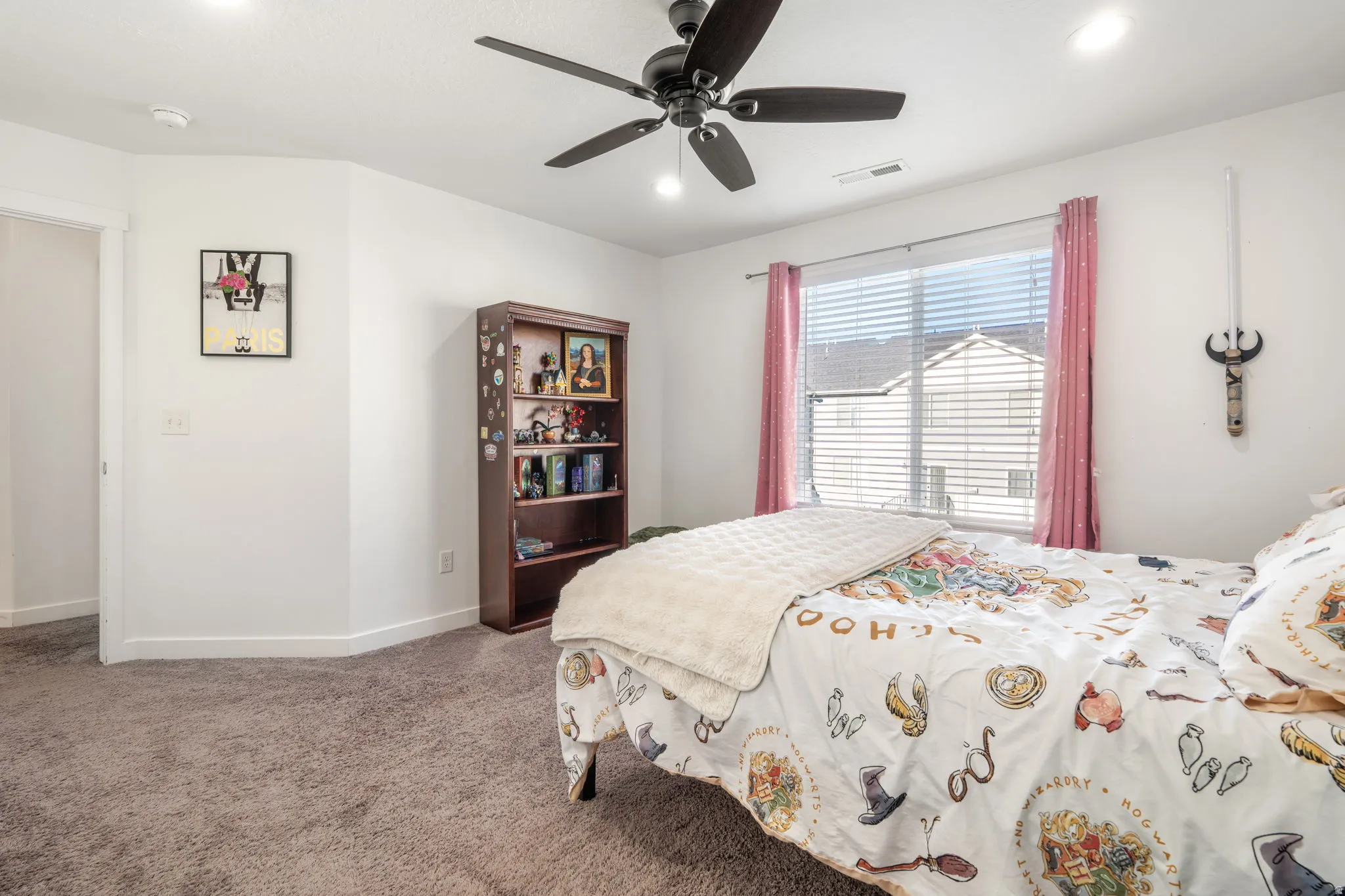 Bedroom with a ceiling fan, carpet, and recessed lighting