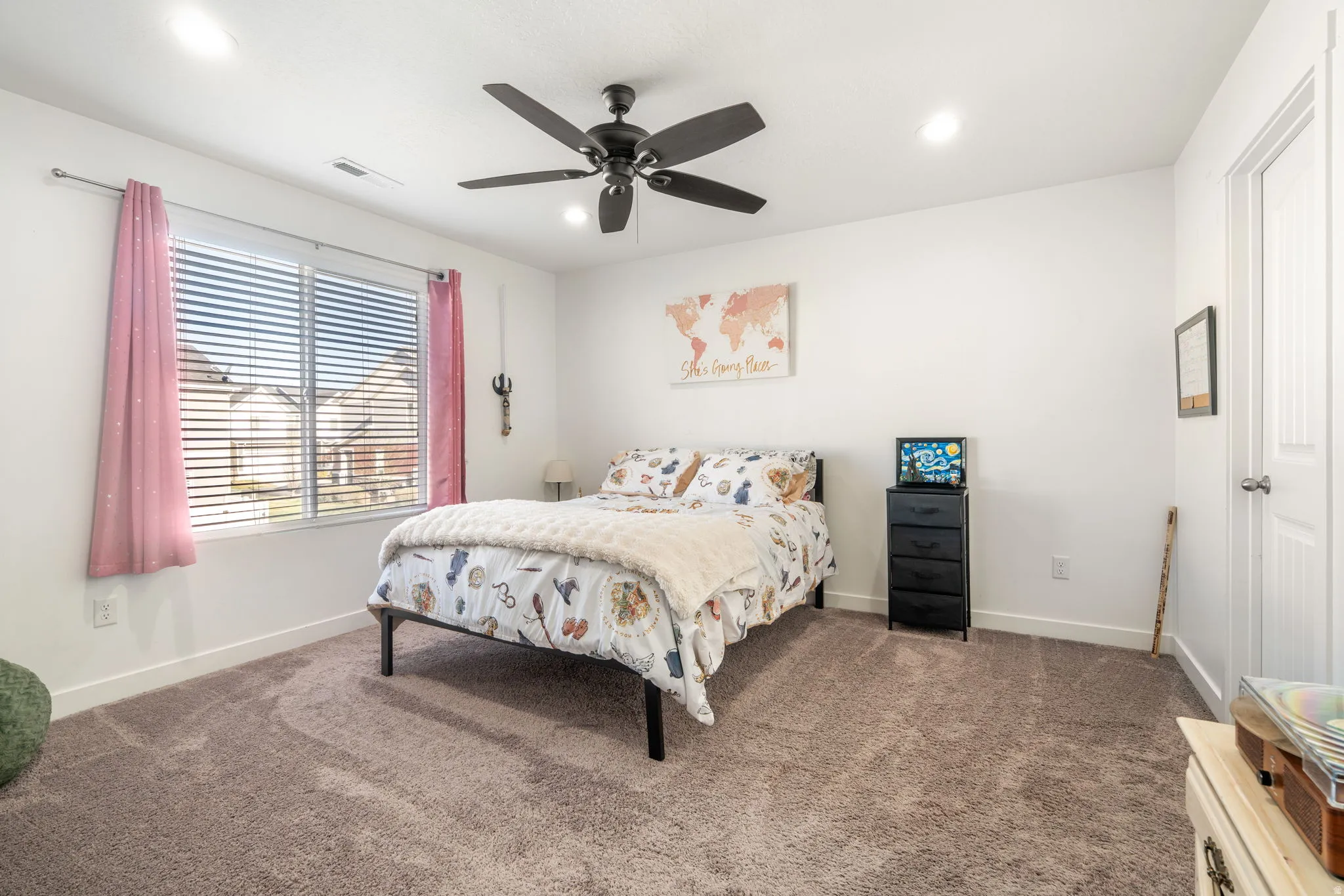 Bedroom featuring ceiling fan, dark colored carpet, and recessed lighting