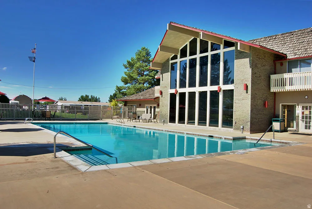 Community pool with a patio