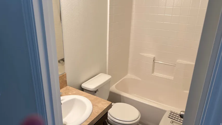 Full bath with vanity,  and washtub / shower combination