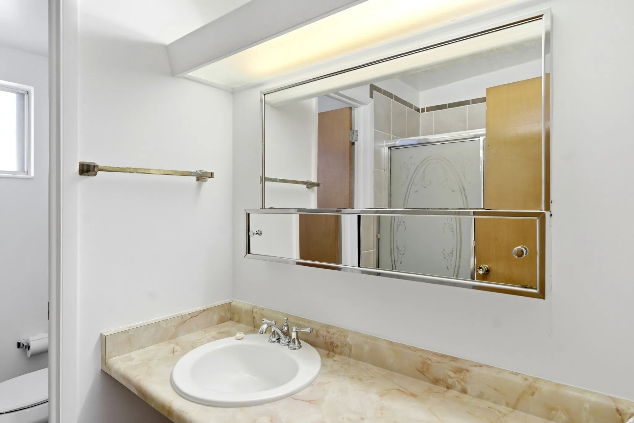 Bathroom featuring toilet and vanity