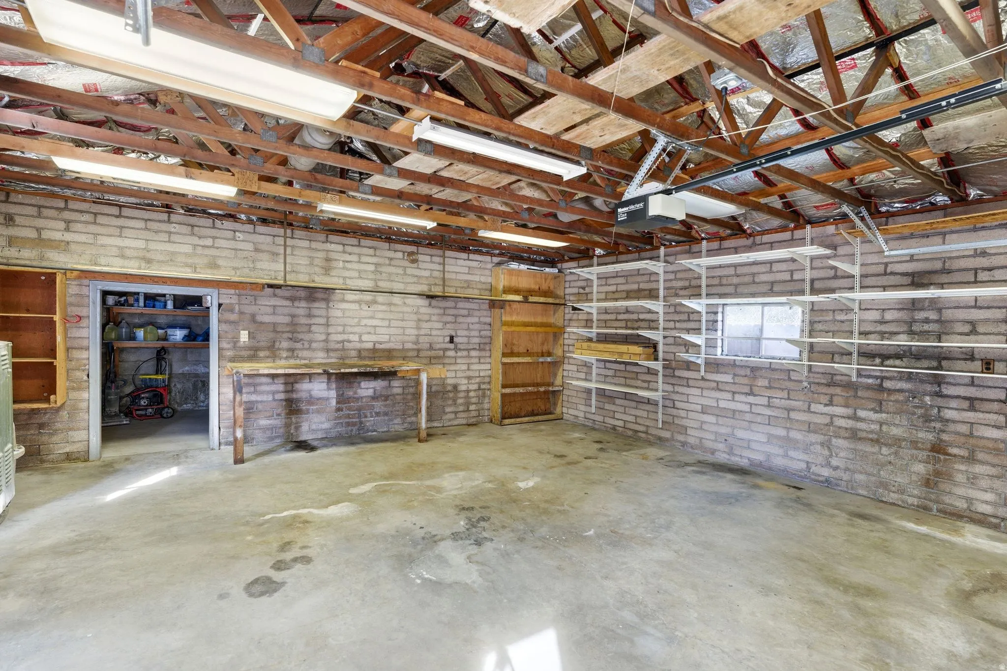 Garage featuring a garage door opener