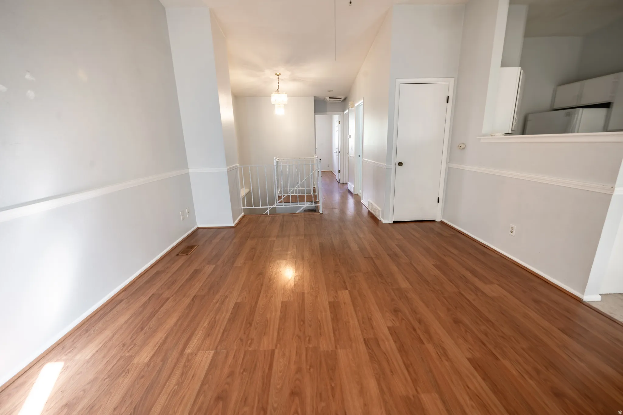Spare room with dark wood-type flooring