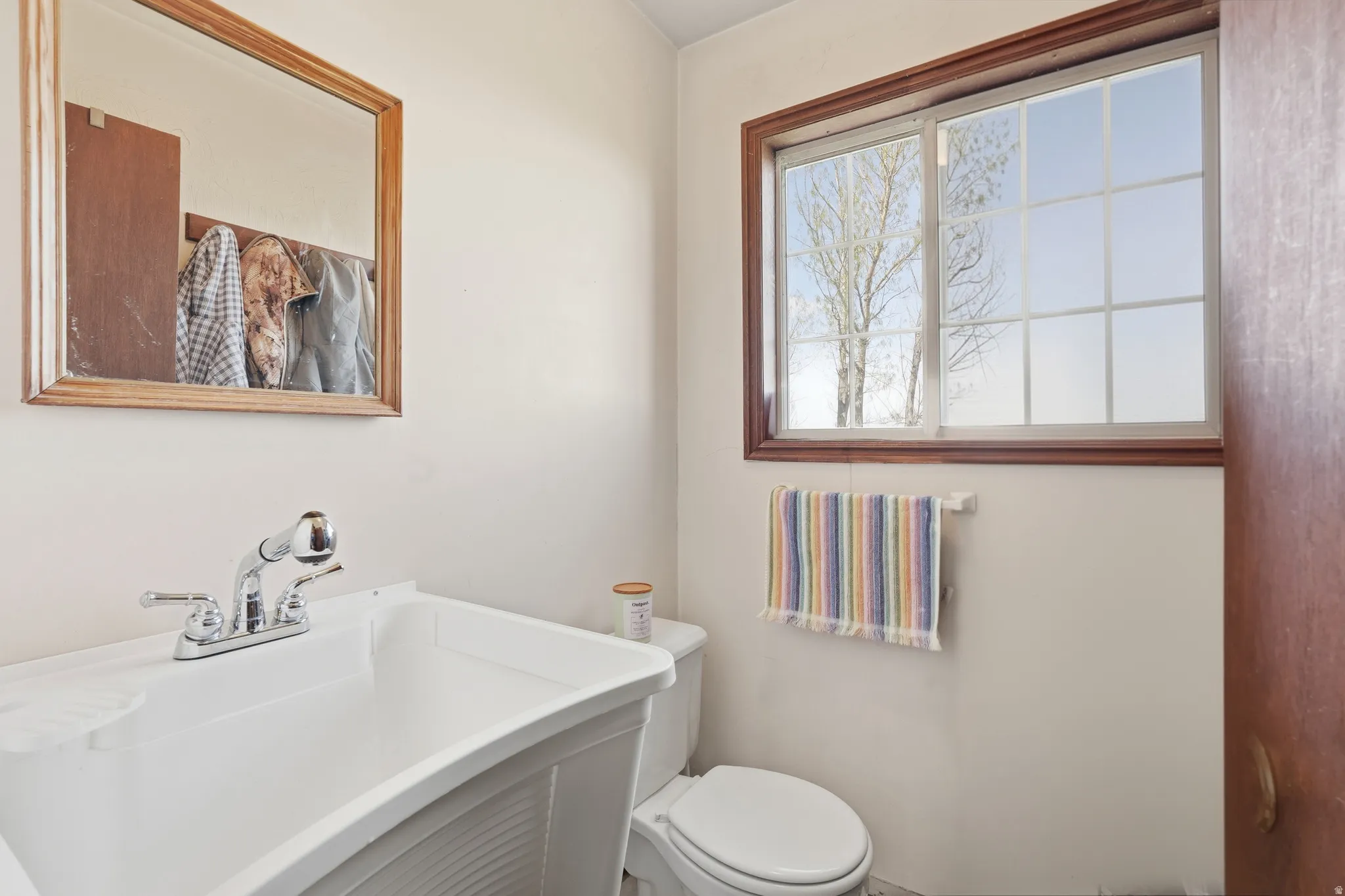 Half bathroom with toilet and vanity