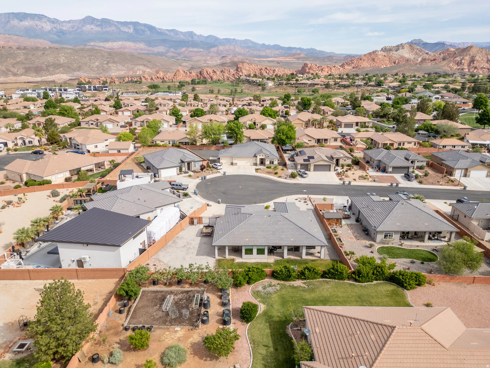 Aerial view of residential area featuring mountains