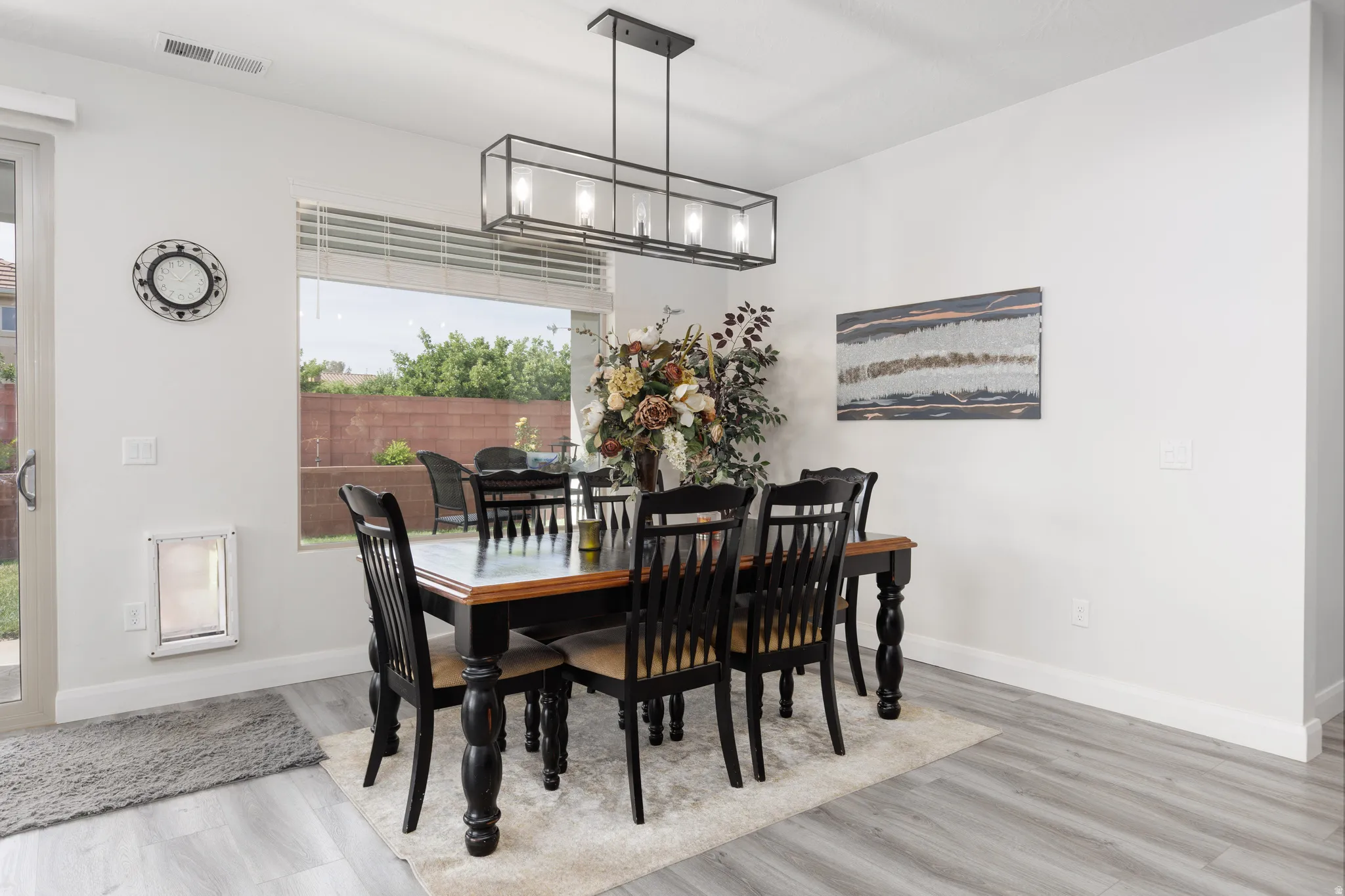 Dining area featuring plenty of natural light and wood finished floors
