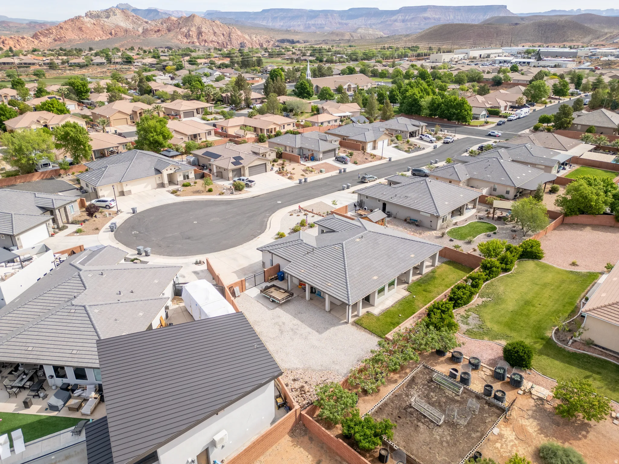 Aerial perspective of suburban area featuring a mountain backdrop