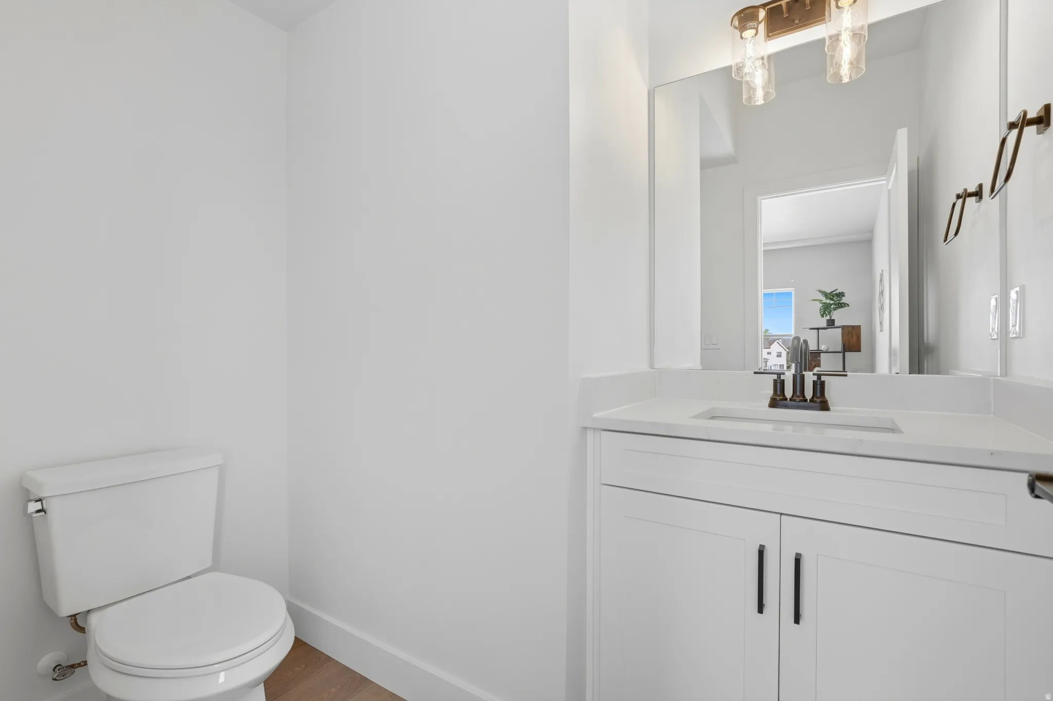 Bathroom with vanity and wood finished floors