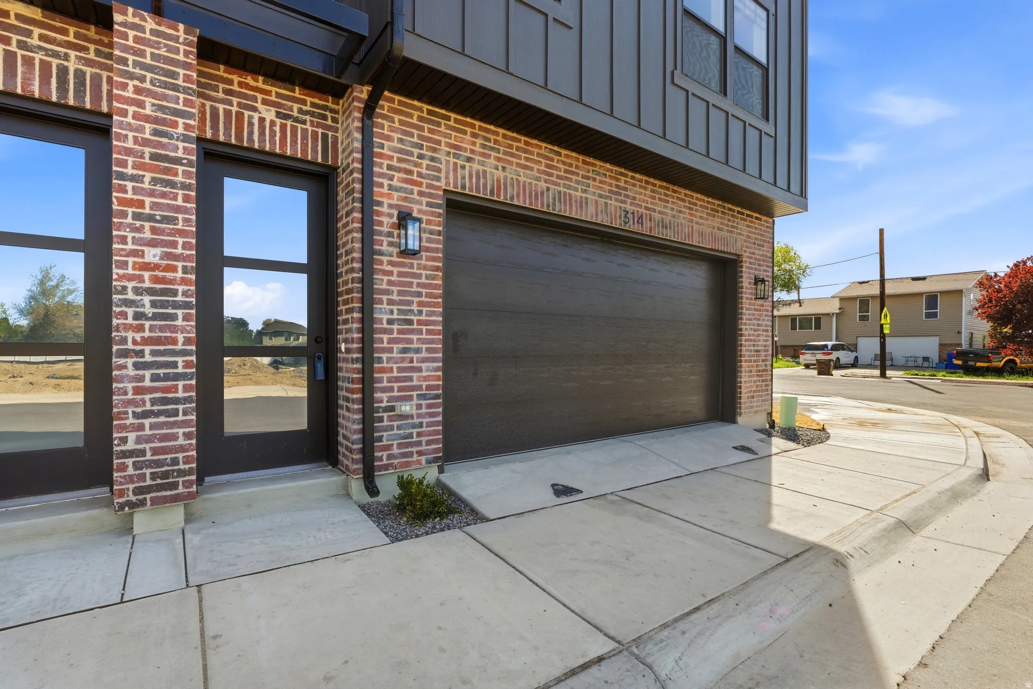 Garage featuring concrete driveway