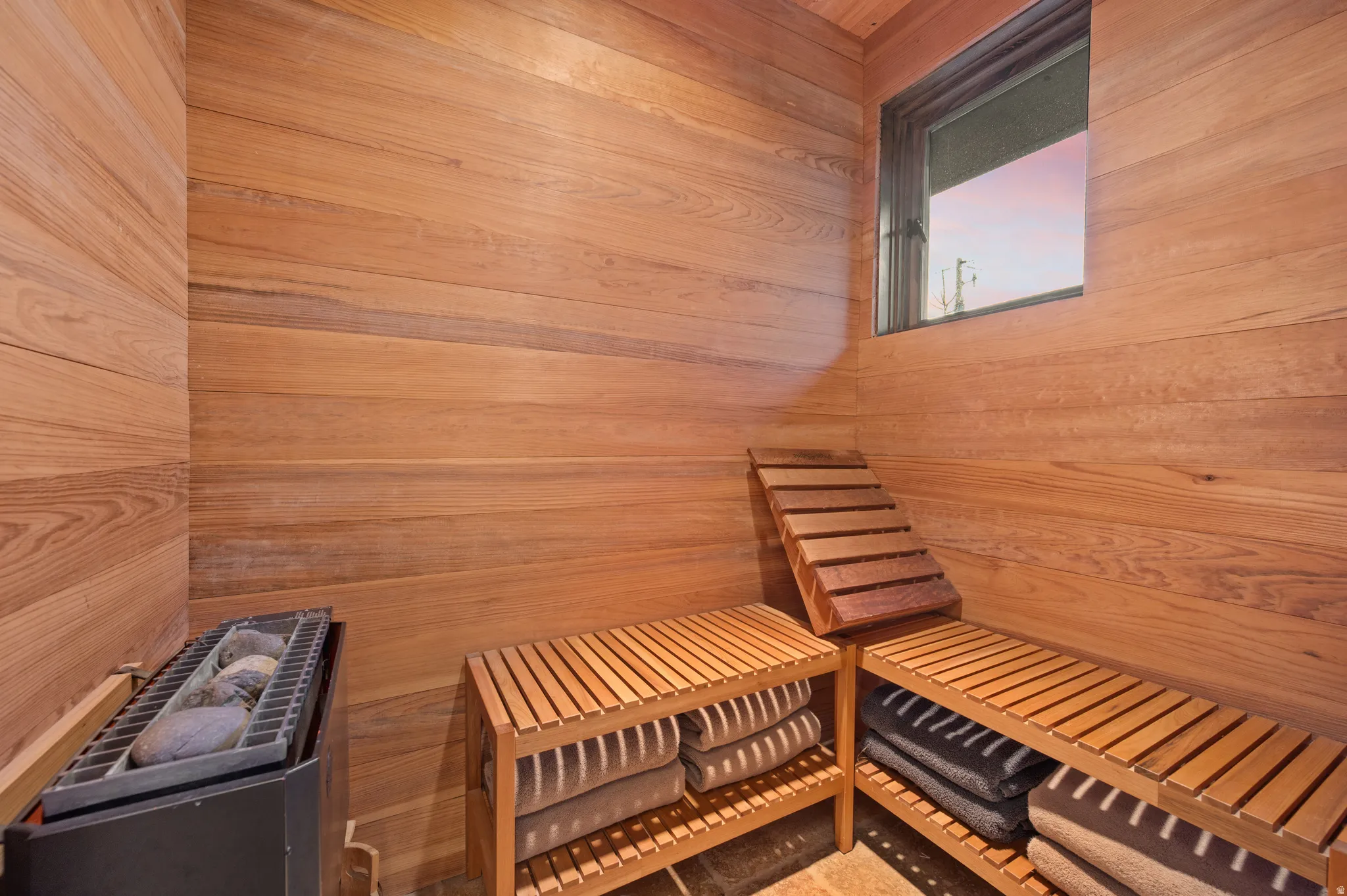 Relaxing sauna featuring wooden walls
