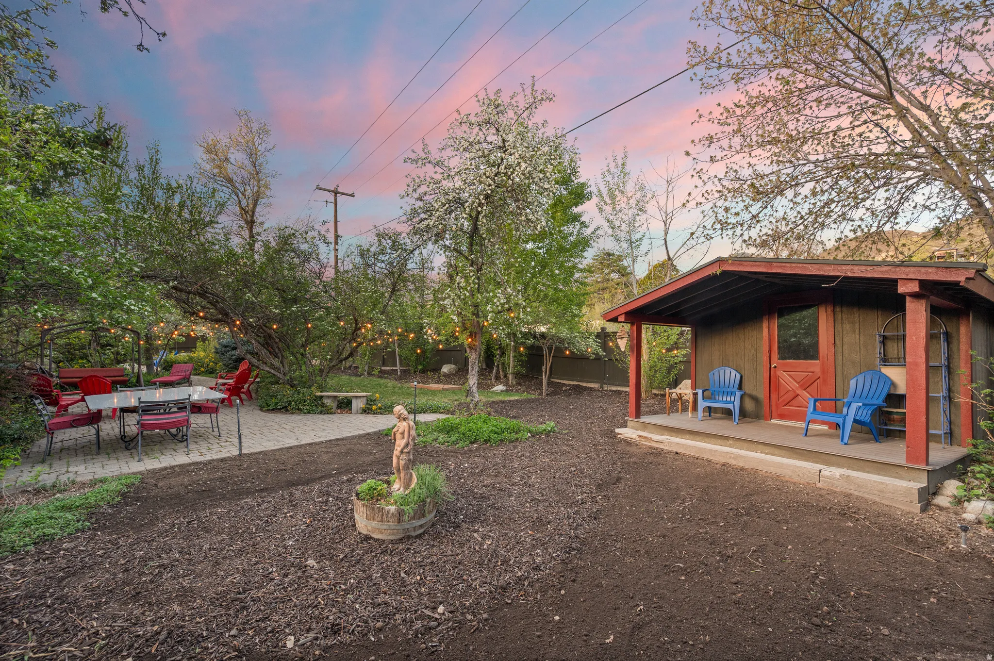 Fenced backyard with an extra built storage