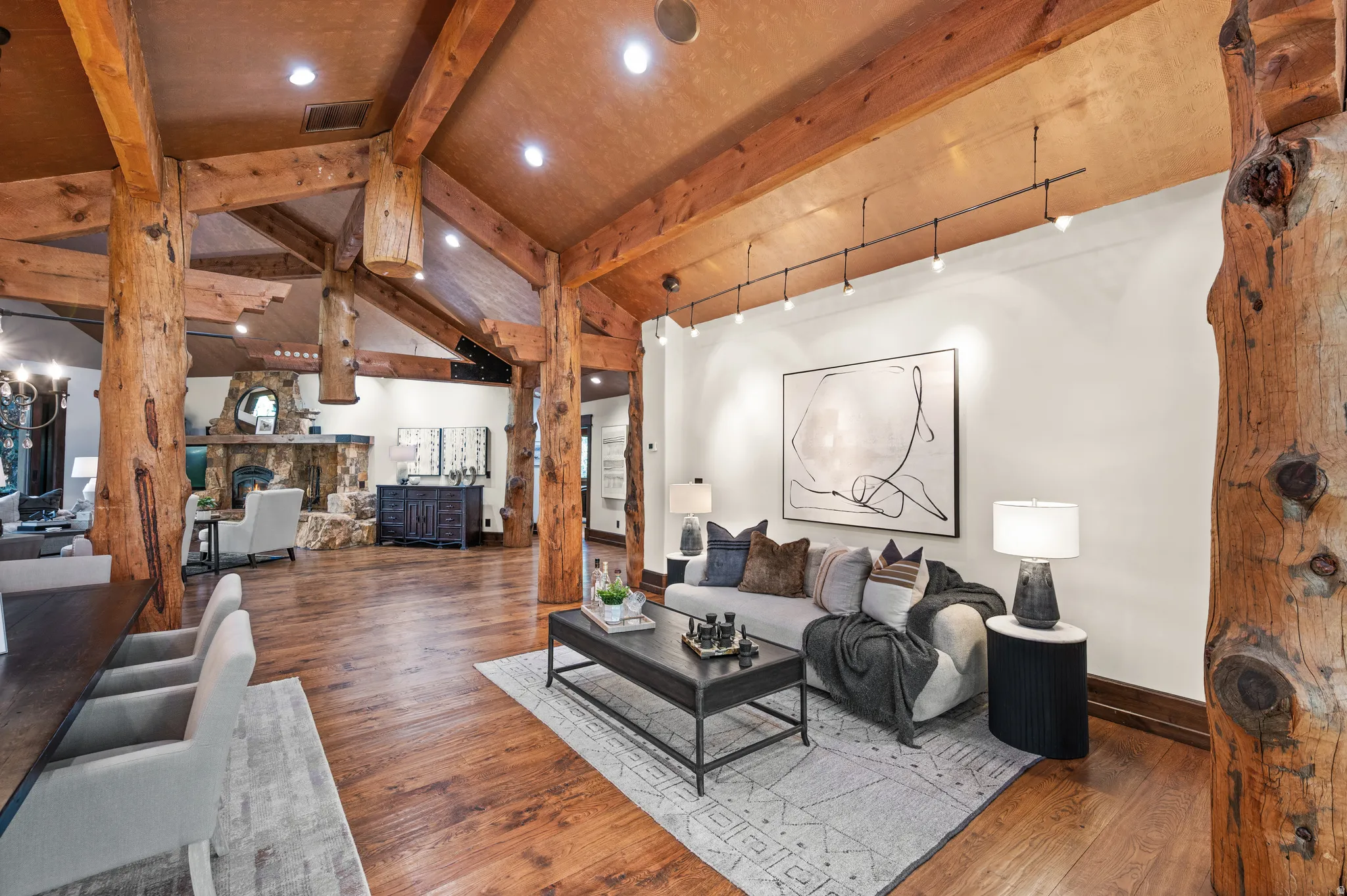 Living room with hardwood / wood-style floors, recessed lighting, and a fireplace