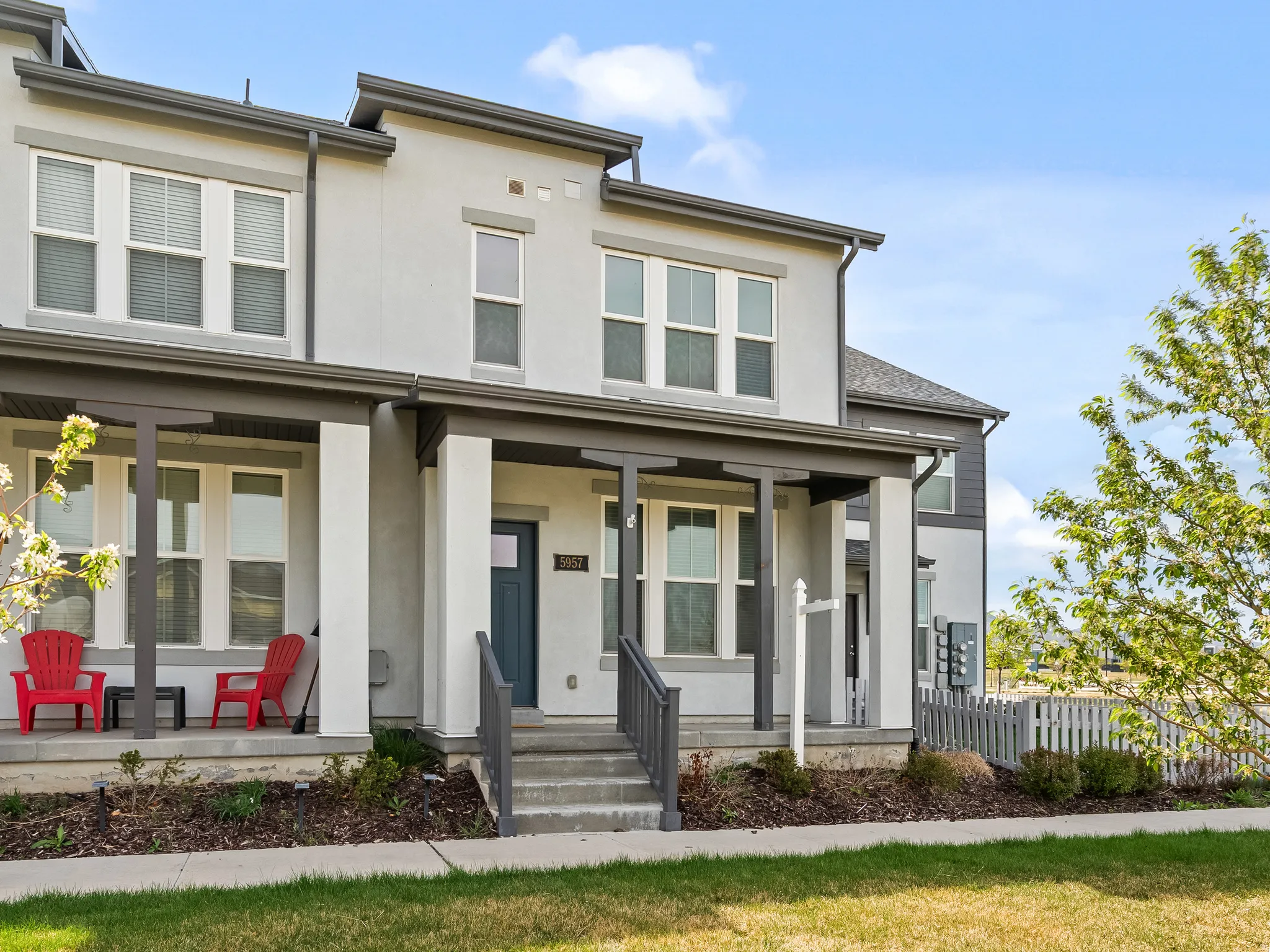 View of front of property with stucco siding and covered porch