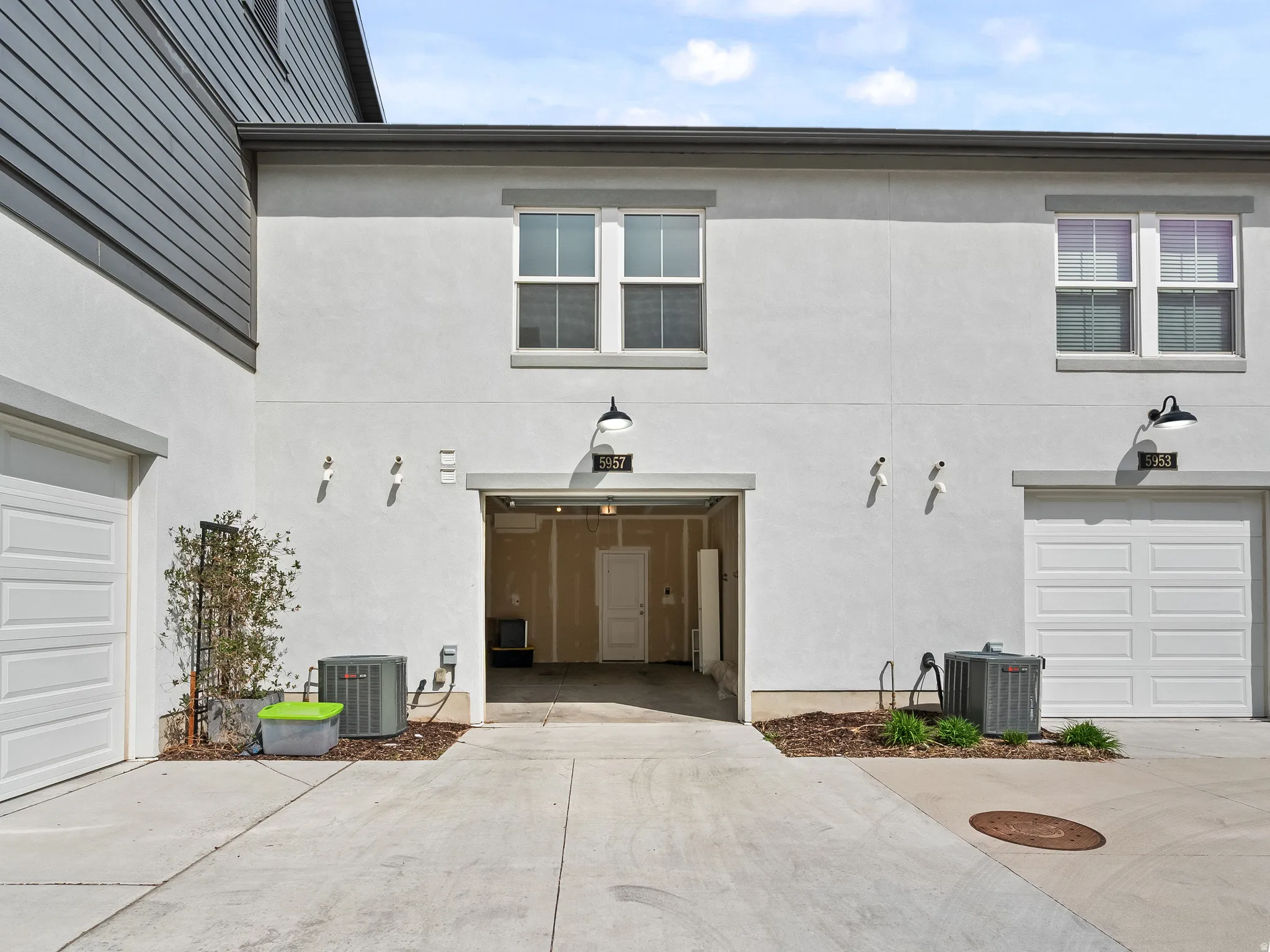 Garage featuring concrete driveway