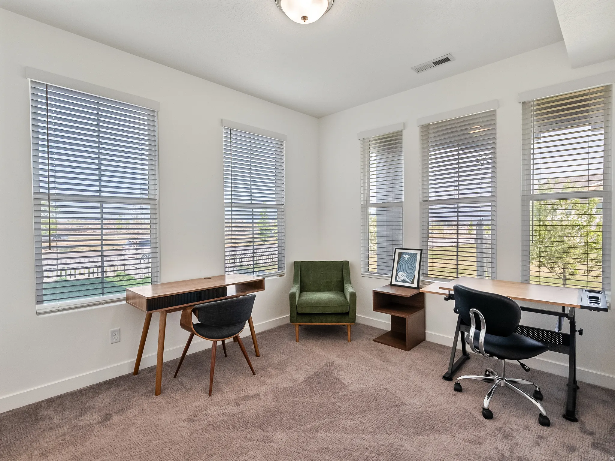 Office area featuring carpet and plenty of natural light