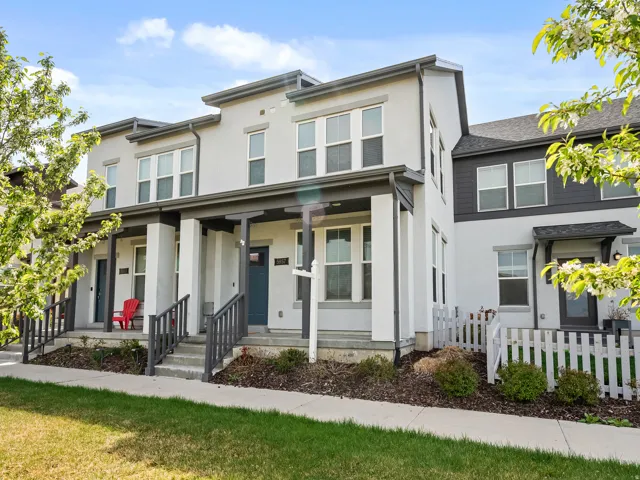 View of front of home featuring stucco siding and a porch