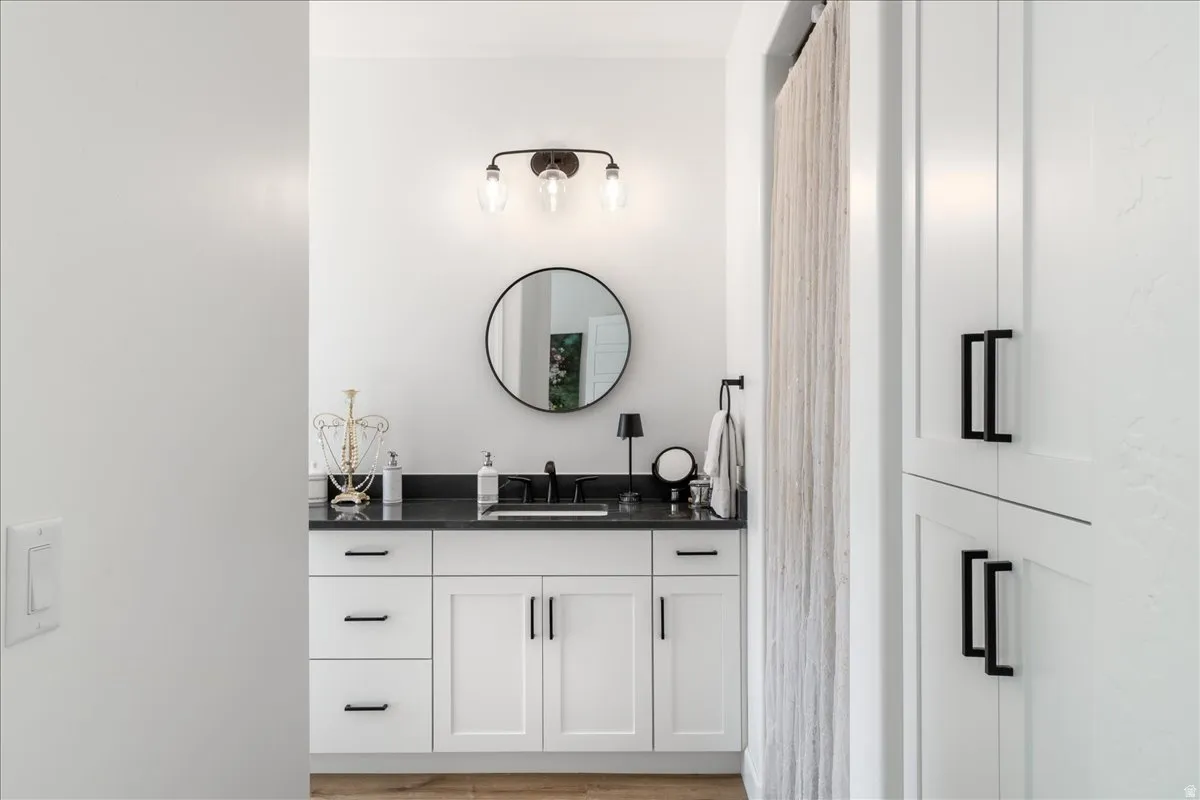 Bathroom with vanity and light wood-type flooring
