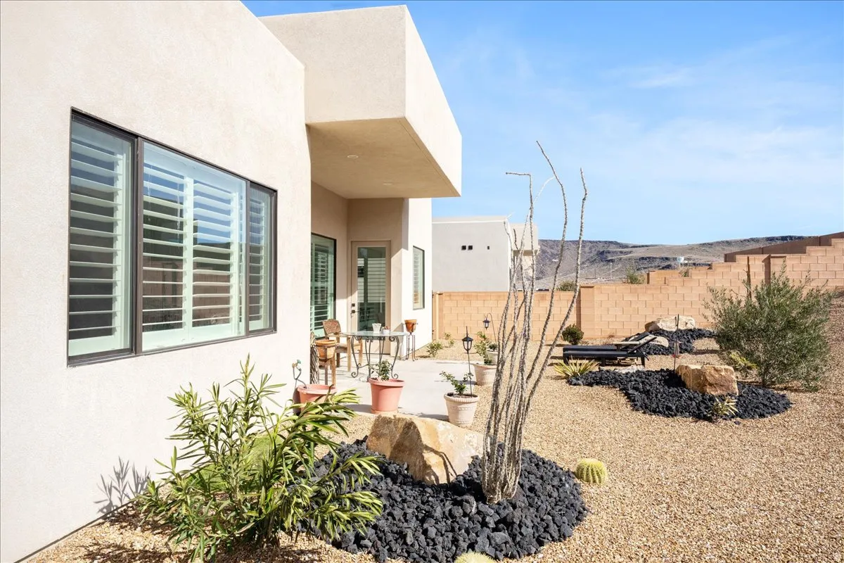 Fenced backyard with a patio