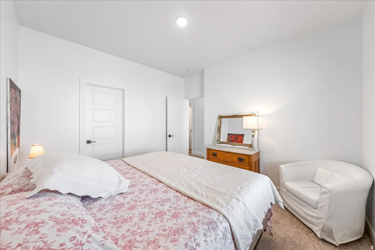 Bedroom with light carpet