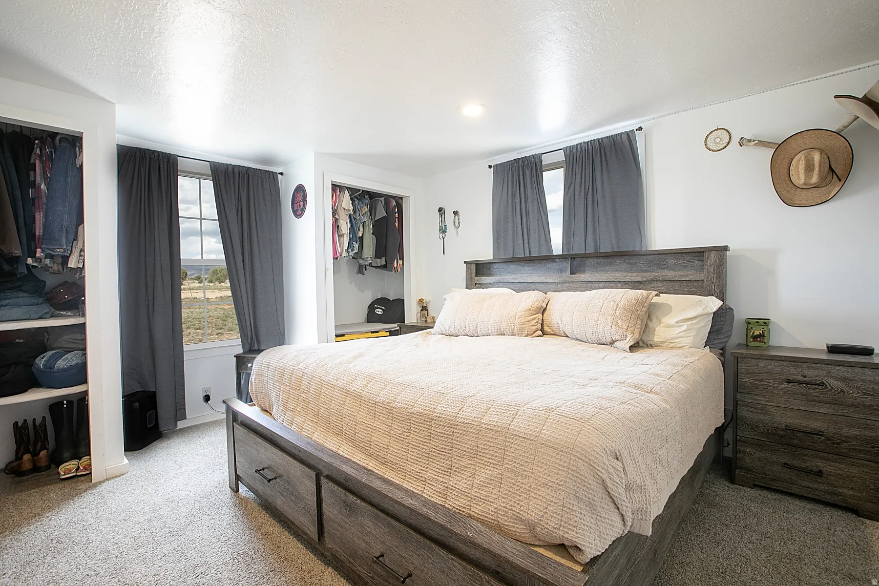 Bedroom featuring carpet floors and a textured ceiling