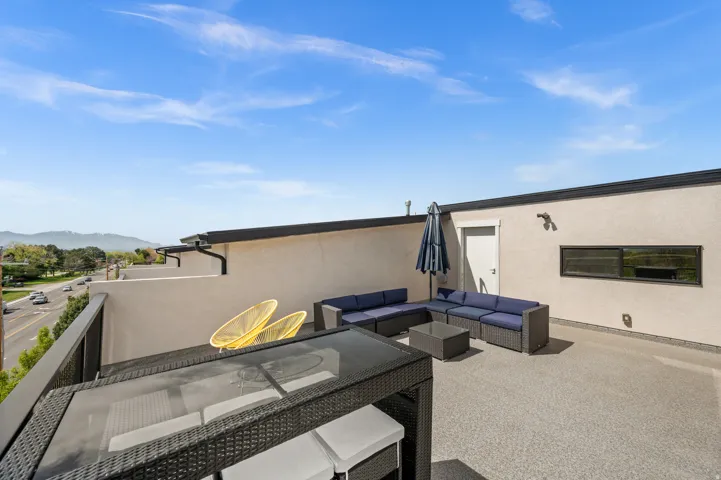 View of patio featuring an outdoor living space and a mountain view
