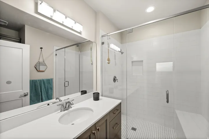 Primary Suite Bathroom featuring vanity, a stall shower, and recessed lighting