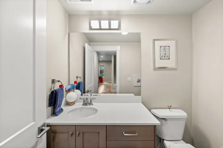 Half bathroom featuring toilet and vanity