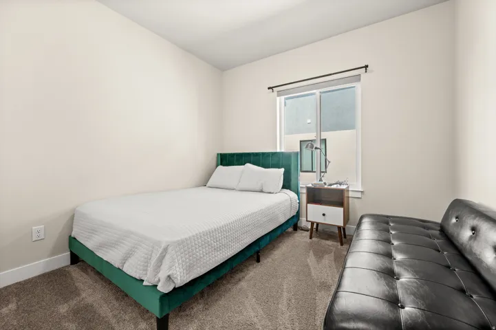Carpeted bedroom with baseboards