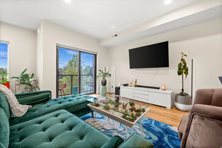 Living room featuring wood finished floors and recessed lighting