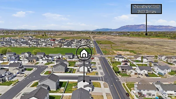 Aerial view of residential area featuring a mountainous background