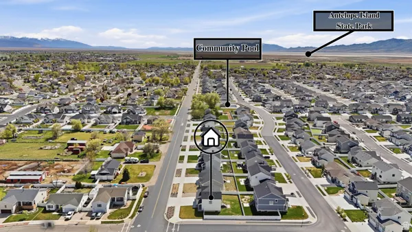 Aerial view of residential area featuring a mountain backdrop