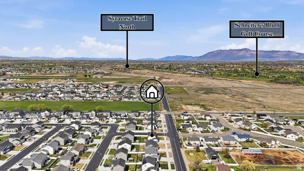 Aerial perspective of suburban area with a mountain backdrop