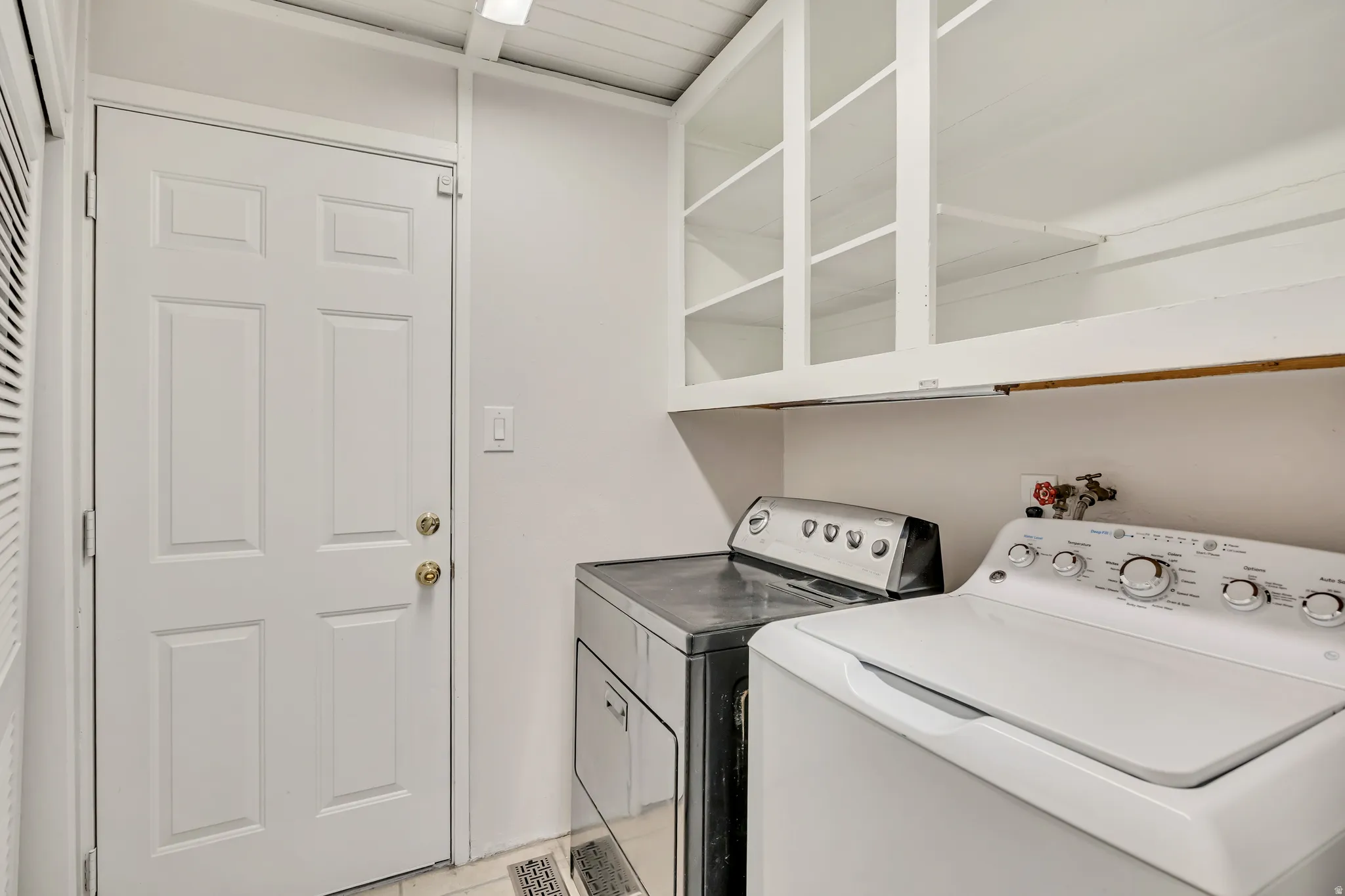 Laundry room featuring washing machine and dryer