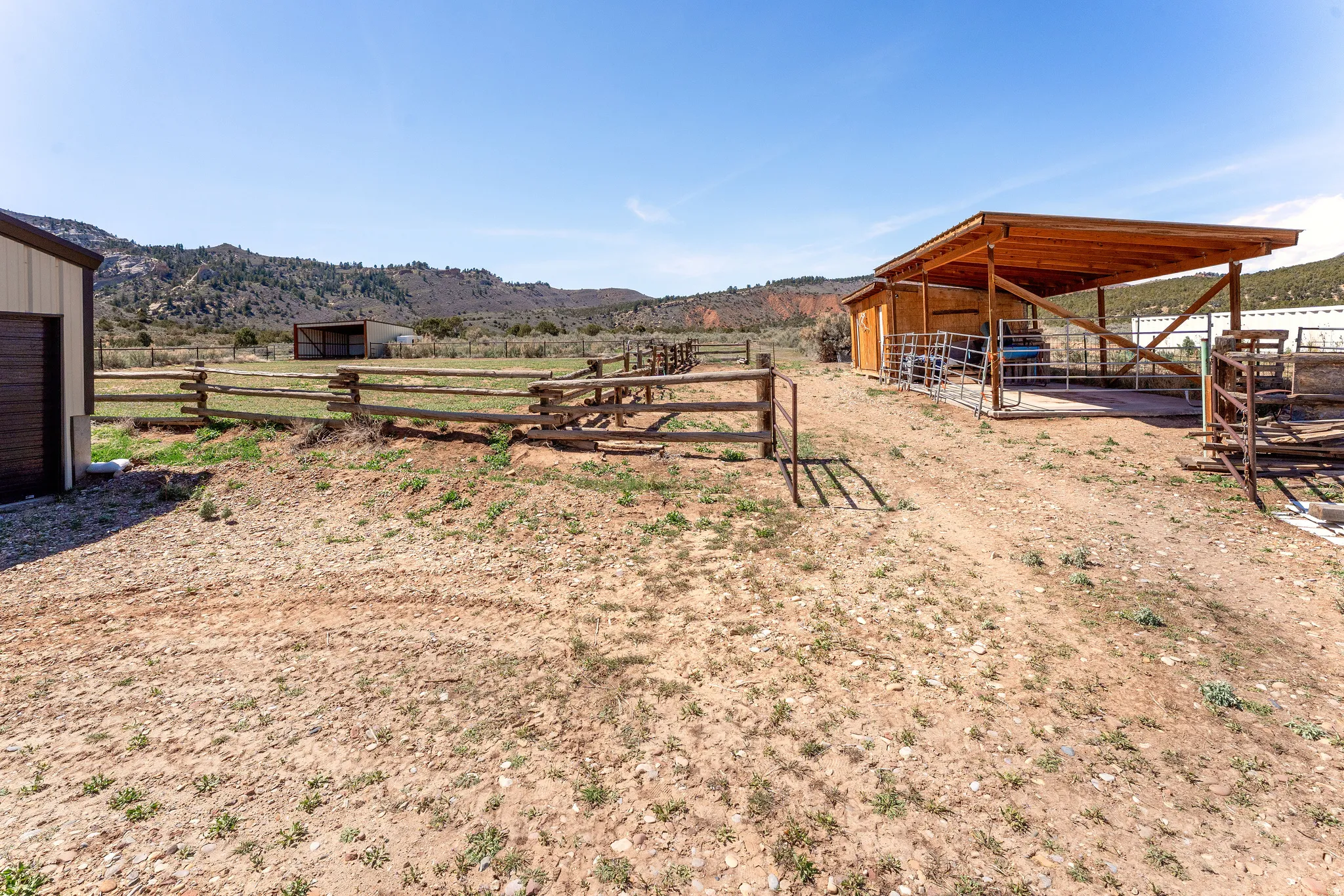 Back pasture, chicken coop, covered storage area and covered cemented area for hay or enclose for a dog run