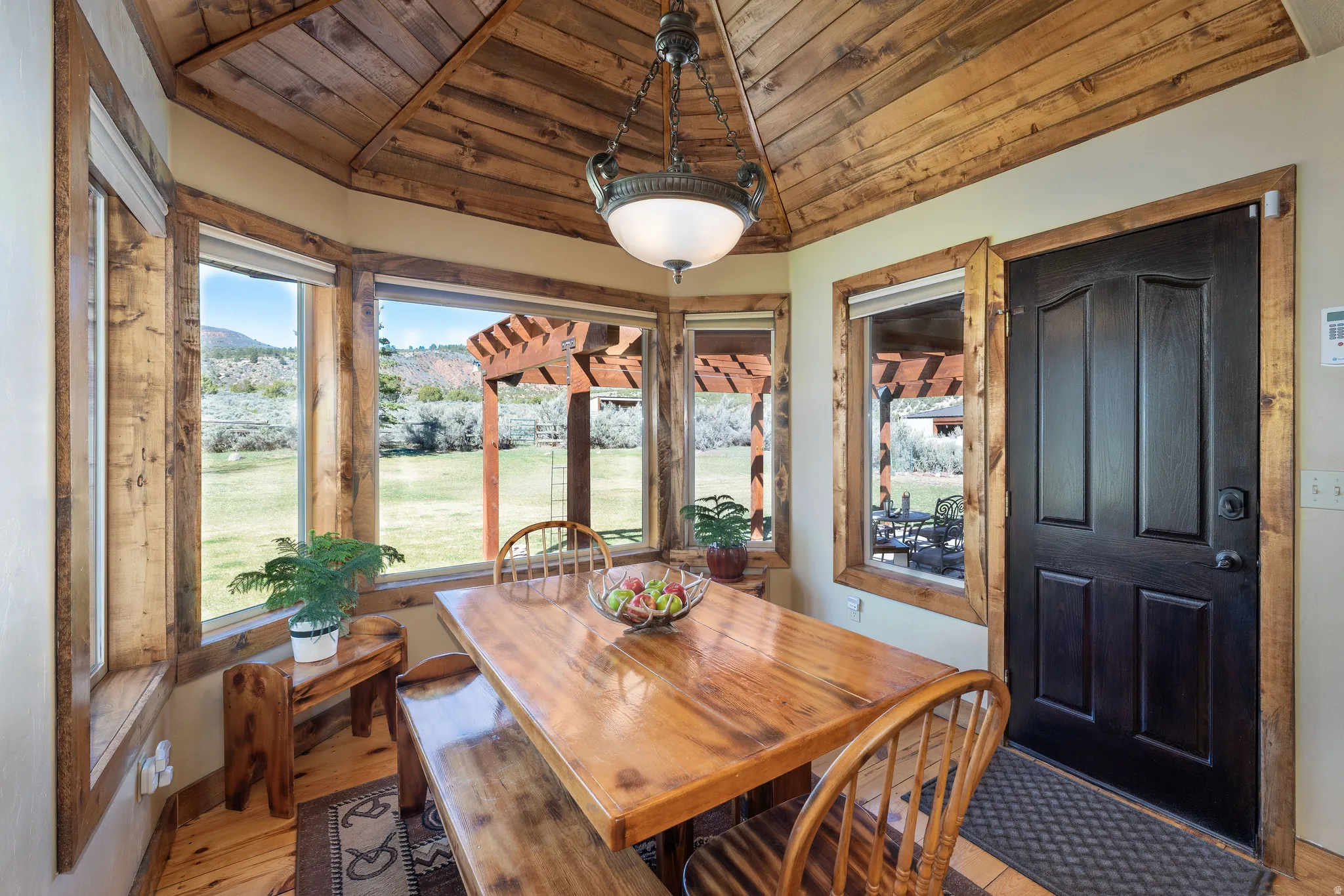 Dining space with a vaulted wooden ceiling