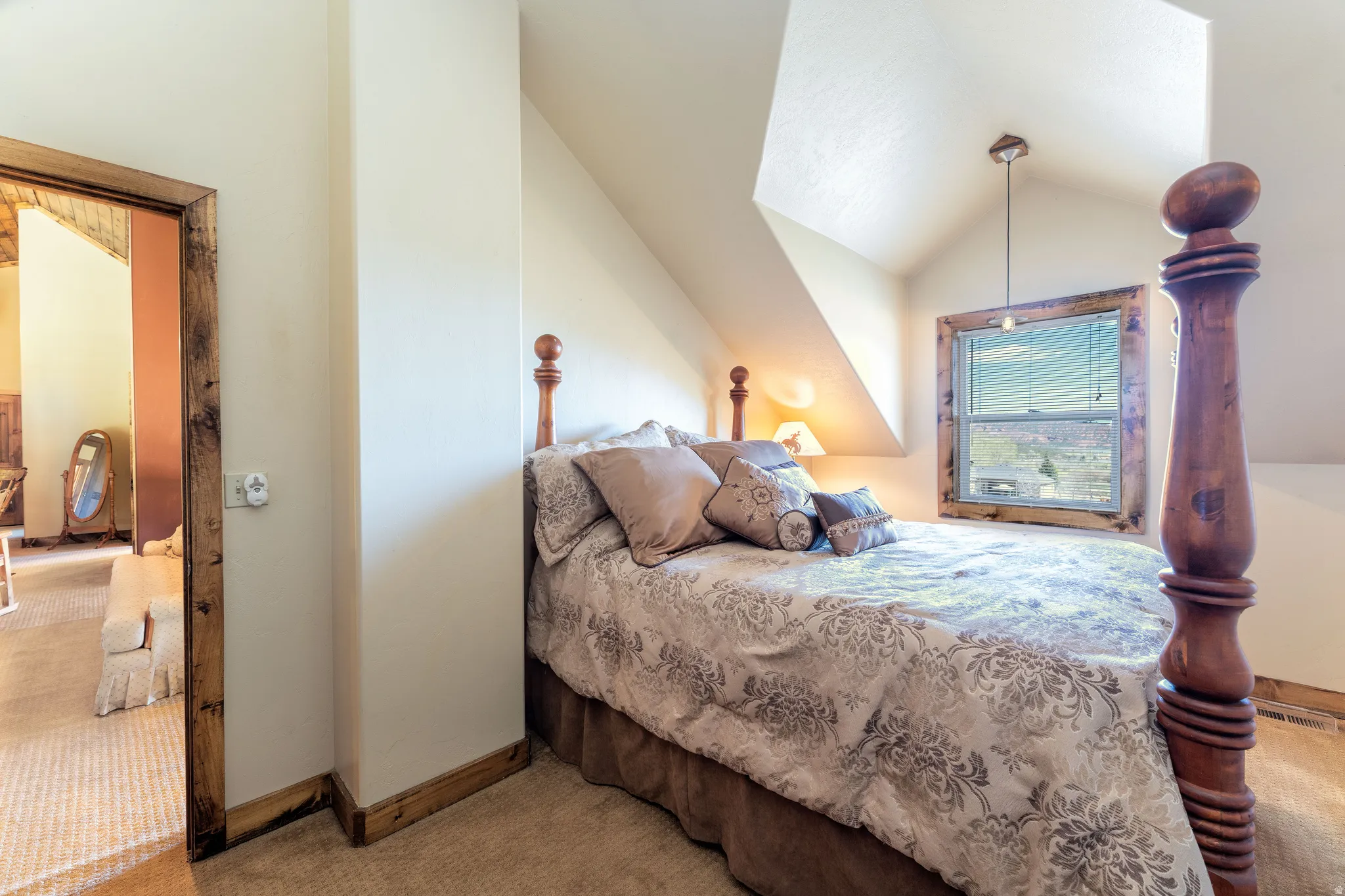 Bedroom 1 on second level with lofted ceiling