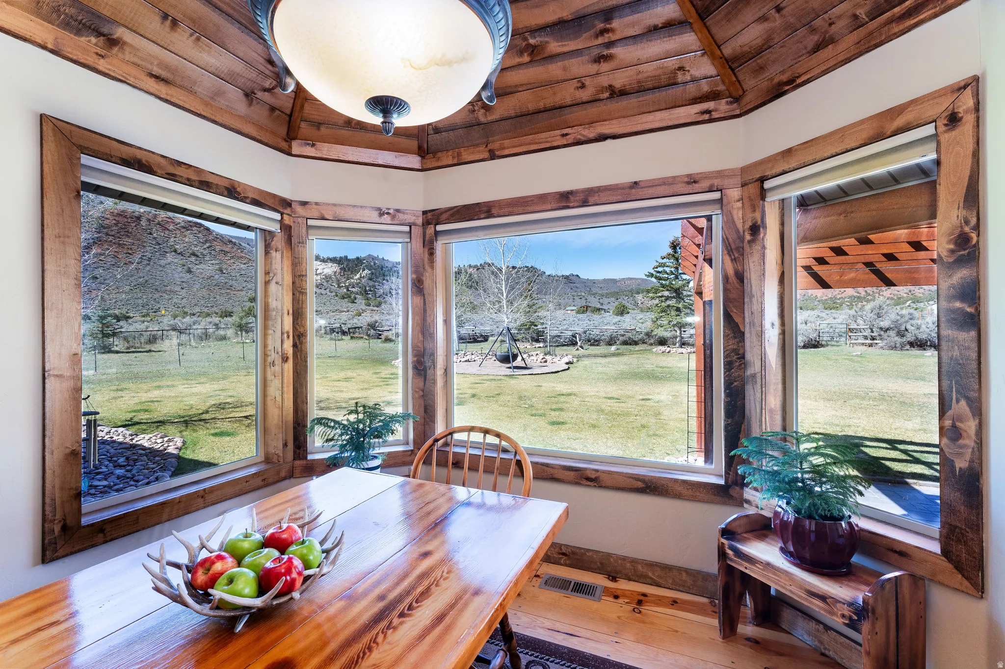 Dining room featuring backyard and gorgeous mountain views. Sit and watch the wildlife!