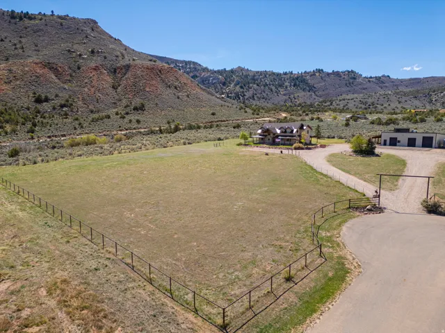 Pipe fenced pasture, home and shop