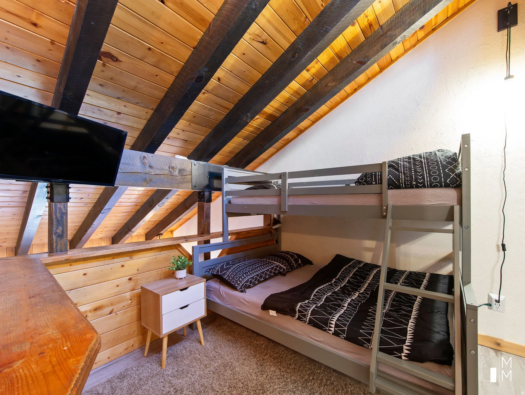 Bedroom featuring wooden ceiling, vaulted ceiling with beams, and light carpet