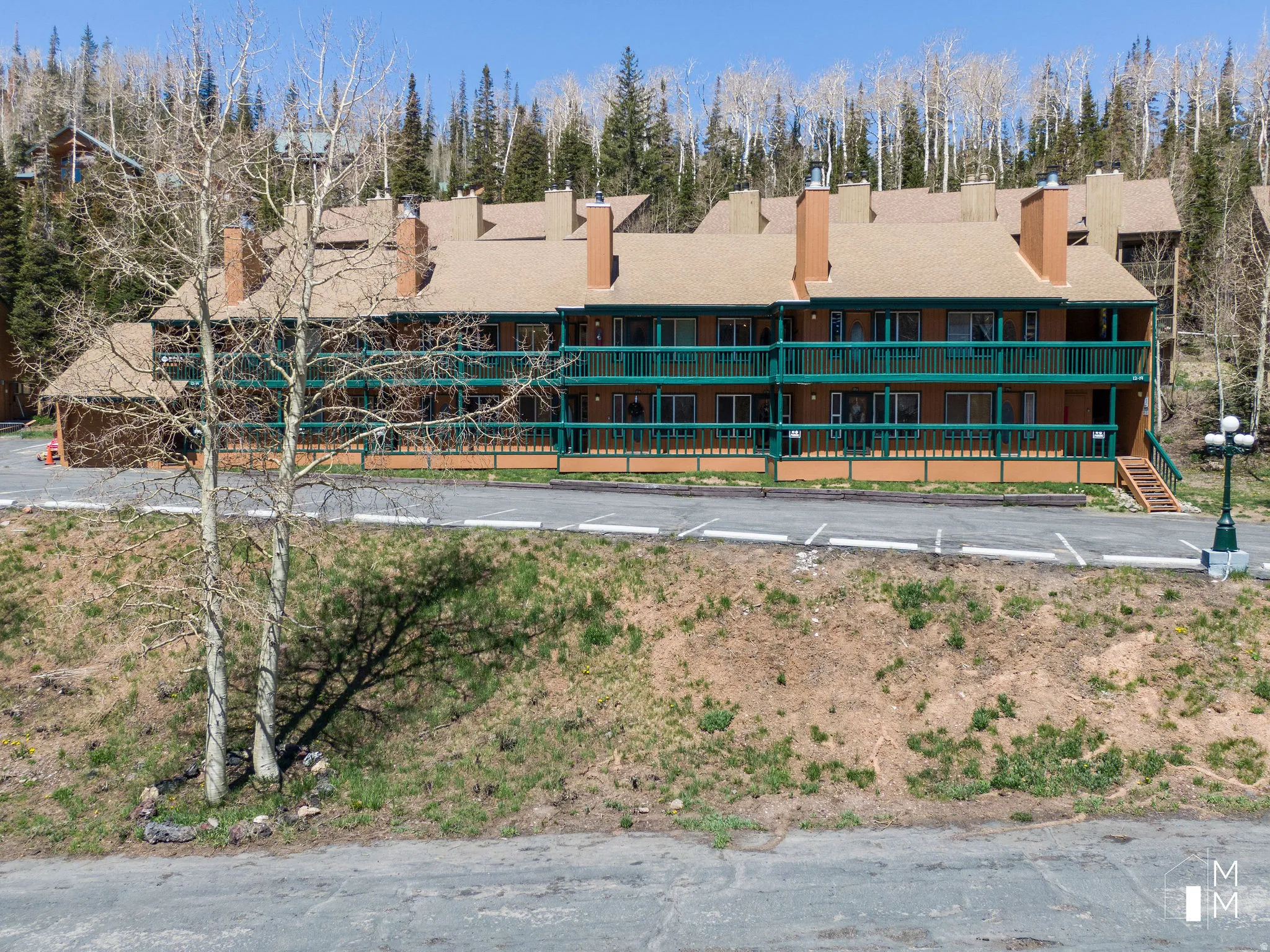 View of building exterior featuring view of scattered trees