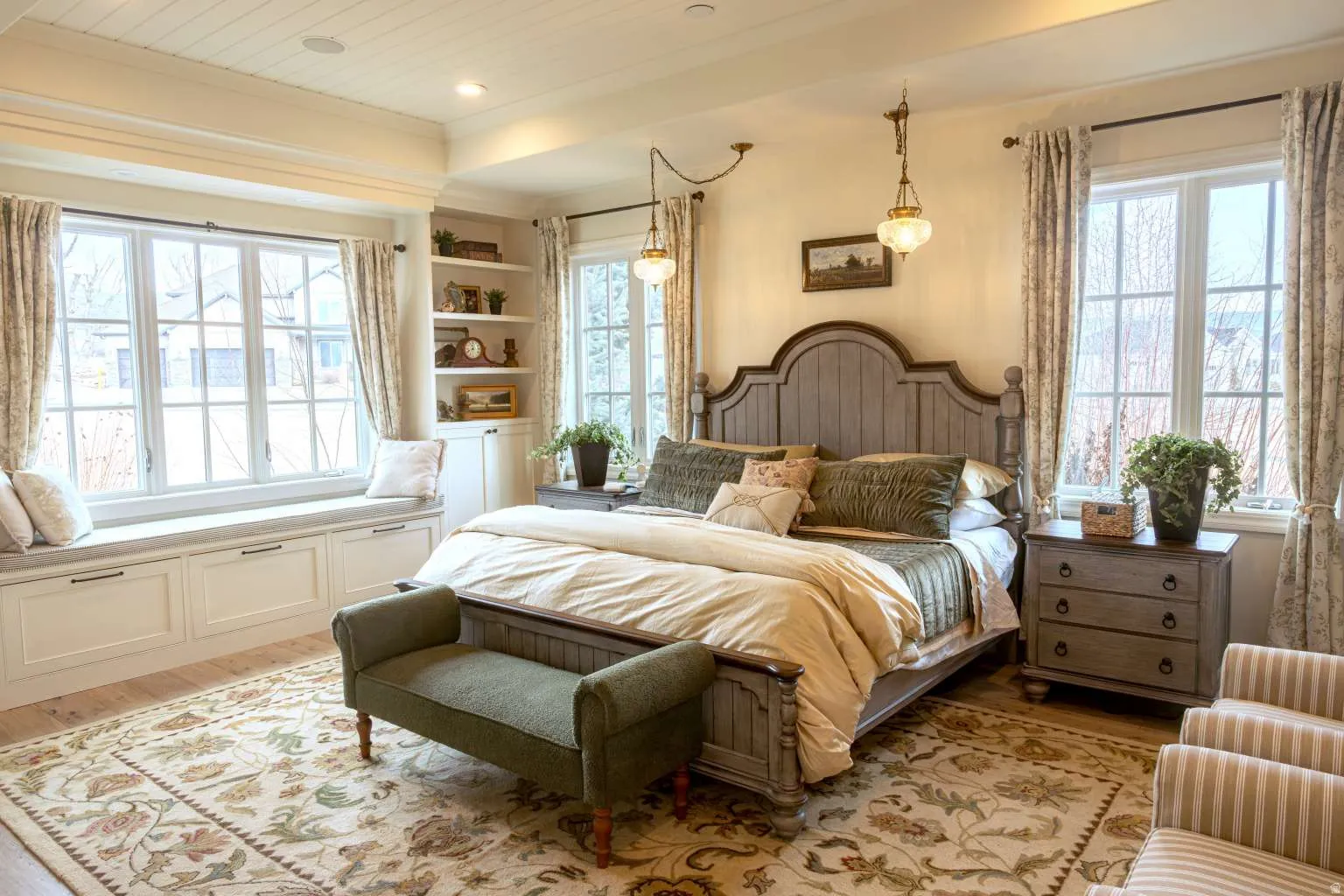 Bedroom featuring light wood-style floors, multiple windows, and wood ceiling