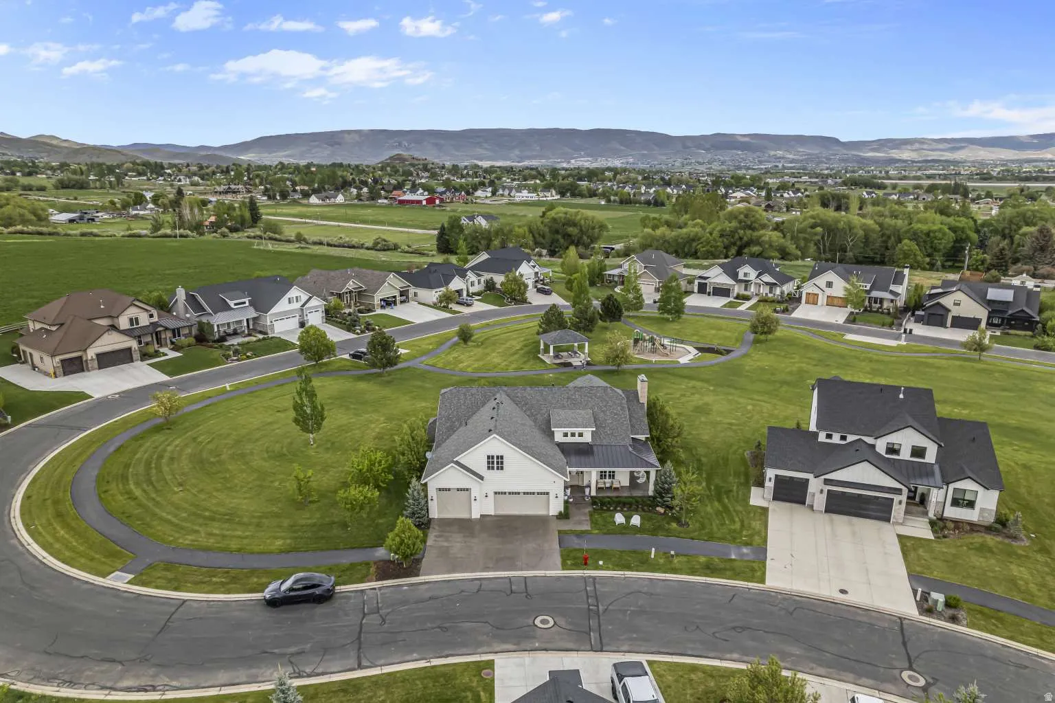 Aerial view of residential area with a mountainous background