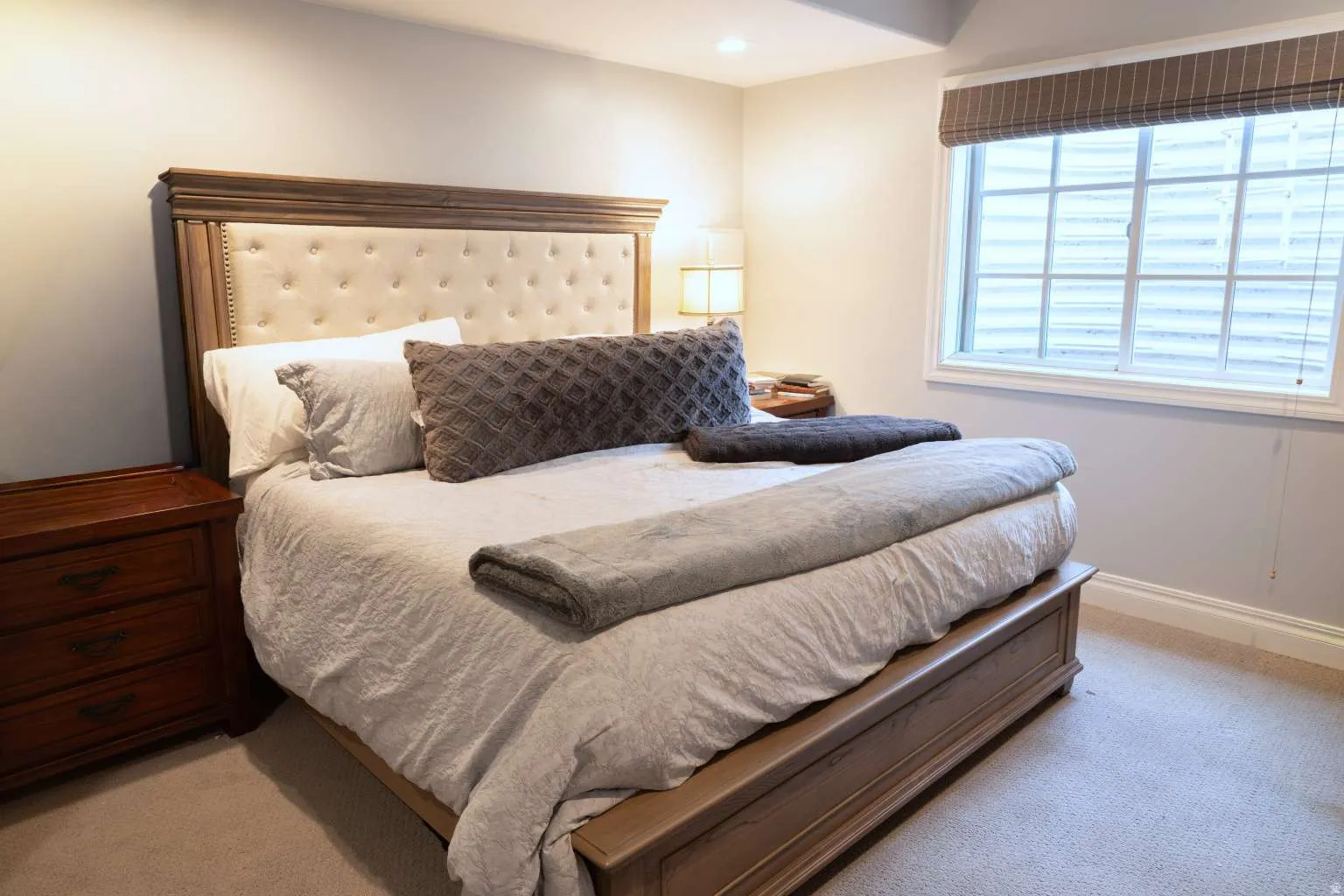 Bedroom with light colored carpet