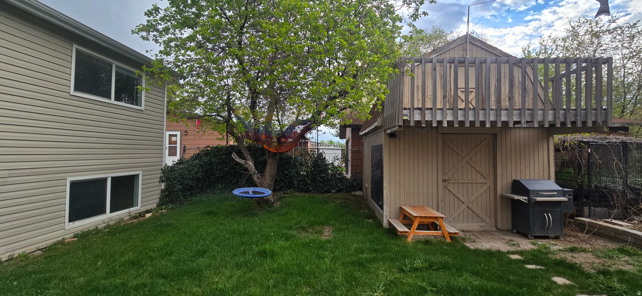 Fenced yard with a storage unit