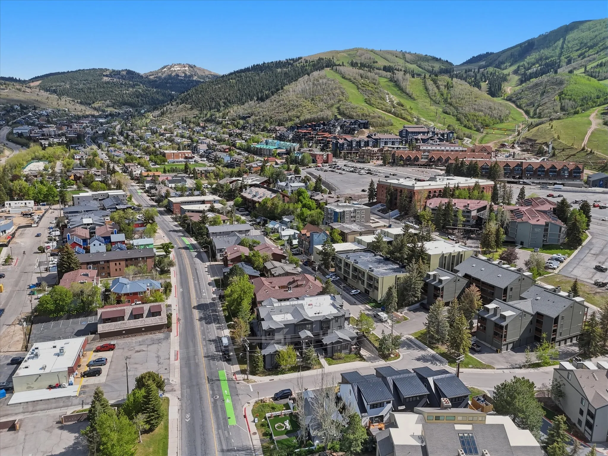 Aerial perspective showcasing a vibrant mountain community with a prominent main street