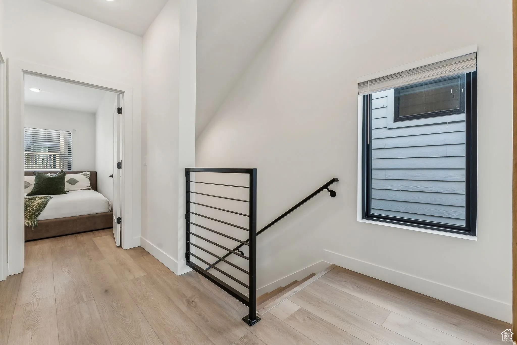 Stairway with baseboards and wood finished floors