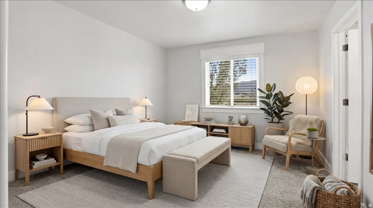 Primary Bedroom with light colored carpet