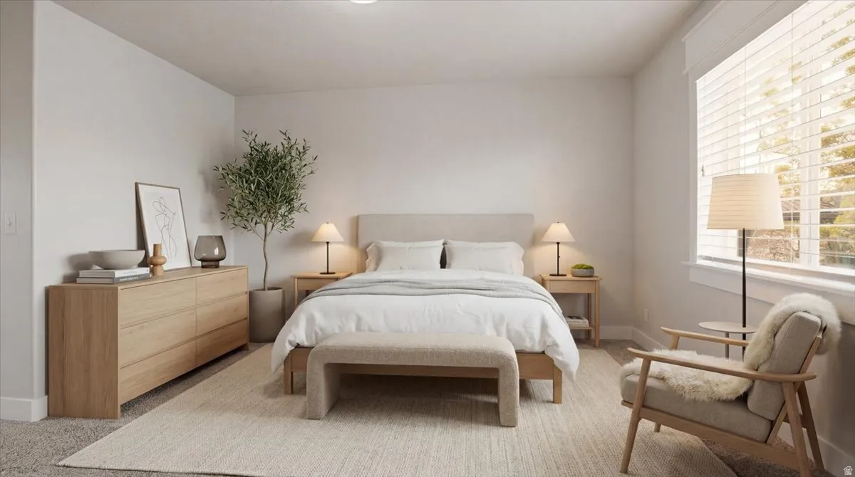 Bedroom with baseboards and carpet floors