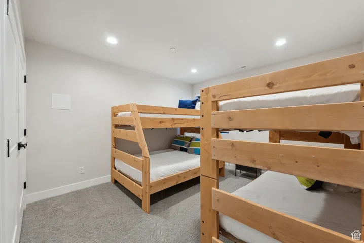 Bedroom featuring recessed lighting and light colored carpet