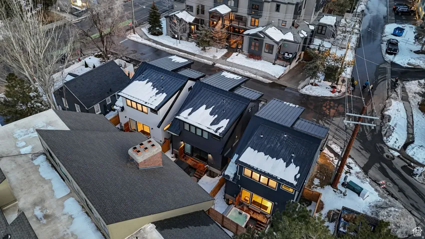 Snowy aerial view with a residential view